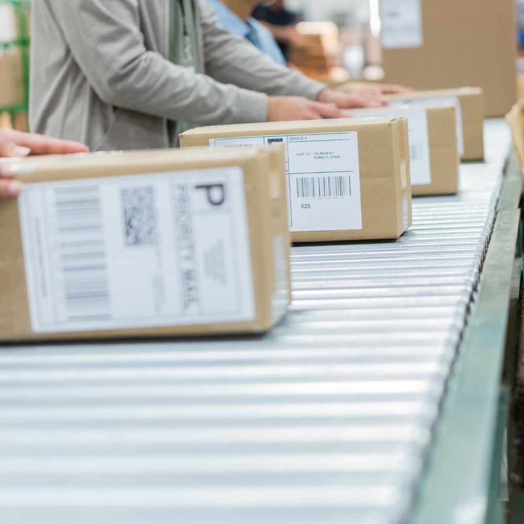 packages coming down conveyor