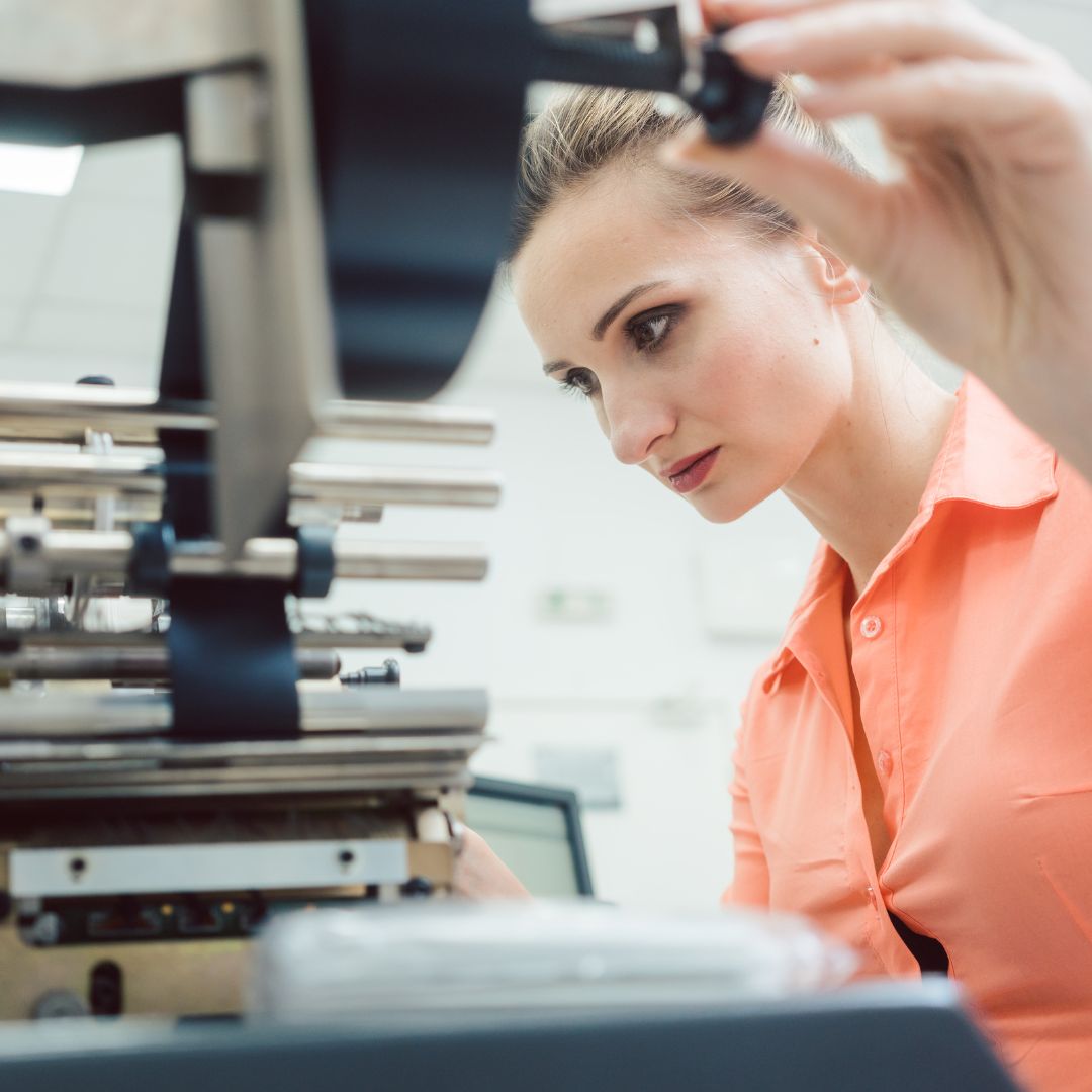 a person working on a printing line