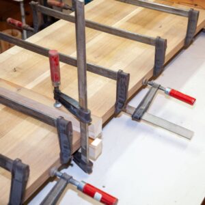 wood being clamped together for adhesive to dry